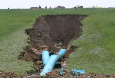 Spillway pipe failure creates sinkhole