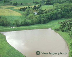 Picture of dam with house below