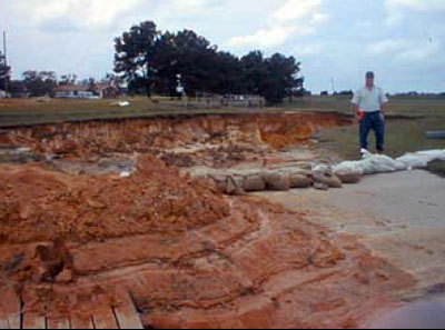 Washout of earth channel emergency spillways