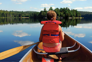 Girl Sitting in a Canoe